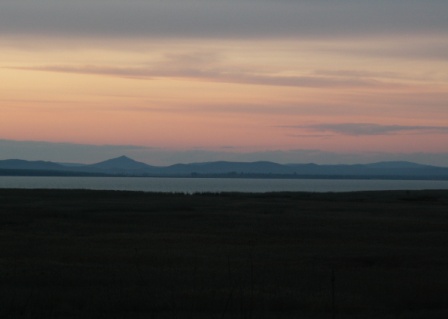 View across Babadag Lake to the hills of Dobruja highlands in March